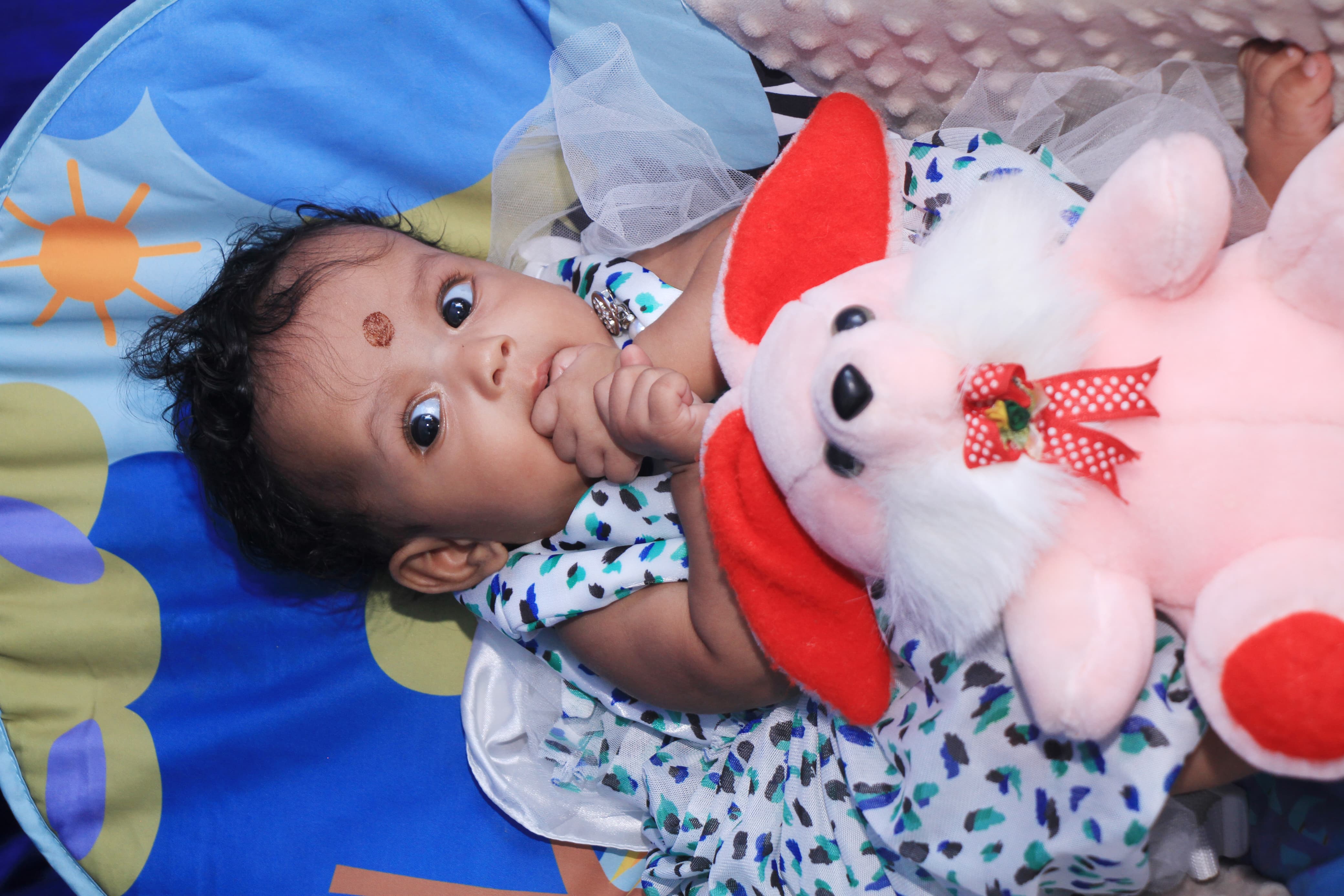 Cute baby looking up with a big smile